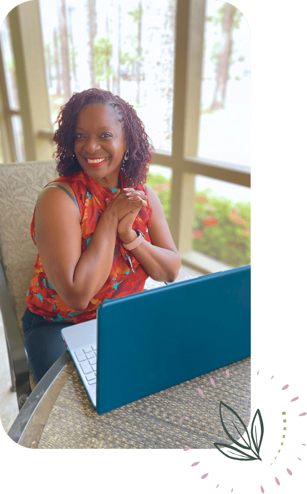 holistic-health-coach-warlesea-604X973 Photo of Warlesea, holistic health coach, sitting at a desk in front of her laptop
